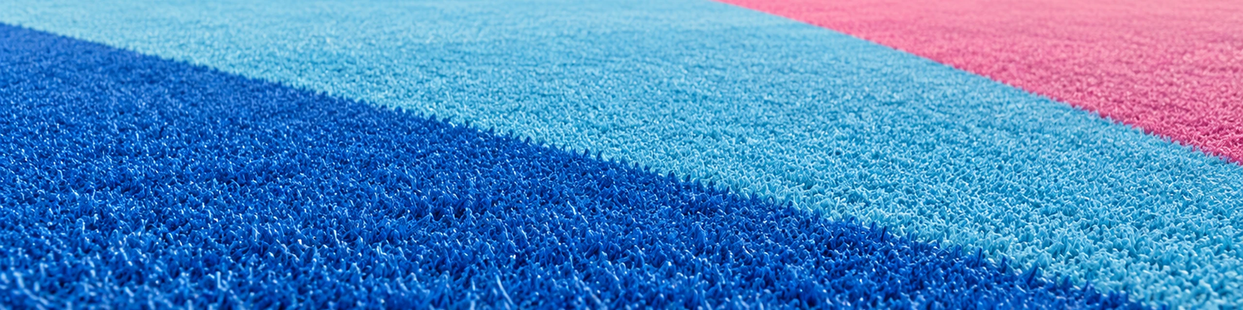 Superficies de césped artificial azul, turquesa y rojo